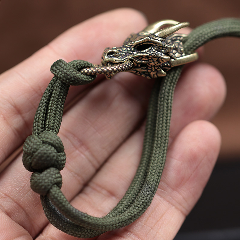 رأس التنين النحاس مشبك EDC في  - مراجعة Paracord Survival Bracelet وسعره